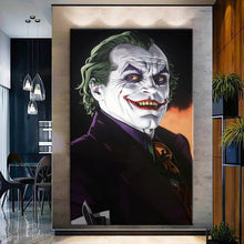 Load image into Gallery viewer, Rolled tube packaging for canvas prints laid on a wooden surface with pink decorative leaves.