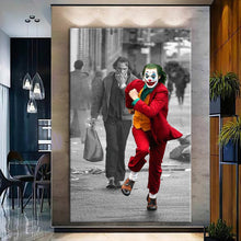 Load image into Gallery viewer, Canvas printed painting of the Joker character, showcasing vibrant colors and bold design, perfect for home decor.