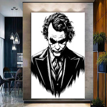 Load image into Gallery viewer, Canvas printed painting of the Joker, featuring bold colors and sharp details in a modern living space.
