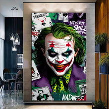 Load image into Gallery viewer, Canvas printed painting of Joker with vibrant colors and dramatic design in a modern living room setting.