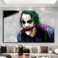 Load image into Gallery viewer, Rolled tube packaging for canvas prints laid on a wooden surface with pink decorative leaves.