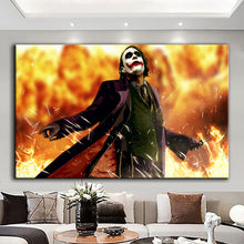 Load image into Gallery viewer, Rolled tube packaging for canvas prints laid on a wooden surface with pink decorative leaves.