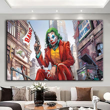 Load image into Gallery viewer, Rolled tube packaging for canvas prints laid on a wooden surface with pink decorative leaves.